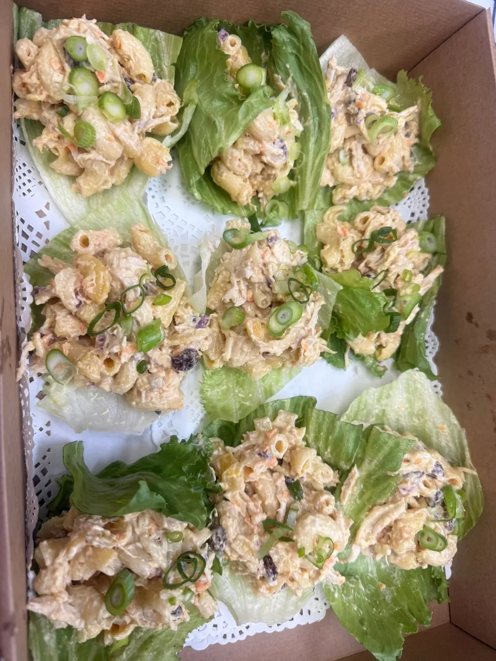 Box of individual lettuce cups prepared for sharing